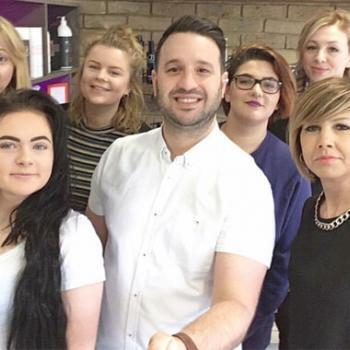 Hairdressing salon owner Frank Di Lusso with his hairdressing assistants.